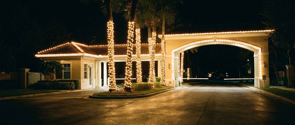 Gated community entrance, Doral: warm white Christmas lighting idea for Doral, FL from Mr. Christmas Lights, (786) 228-6649